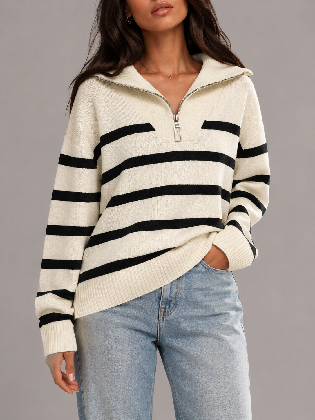 White and Black striped knit half-zip sweater with a relaxed fit, collared neckline, long sleeves, and horizontal stripes
