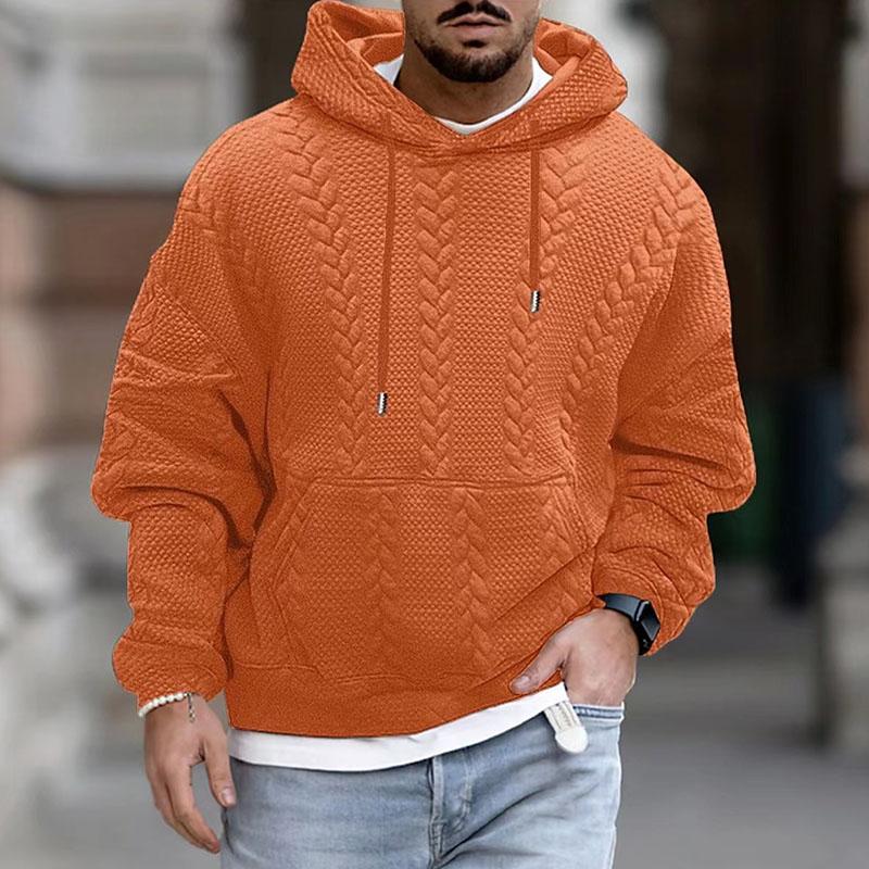 Orange cable knit hoodie for men with a drop shoulder, relaxed fit, drawstring hood, and kangaroo pocket