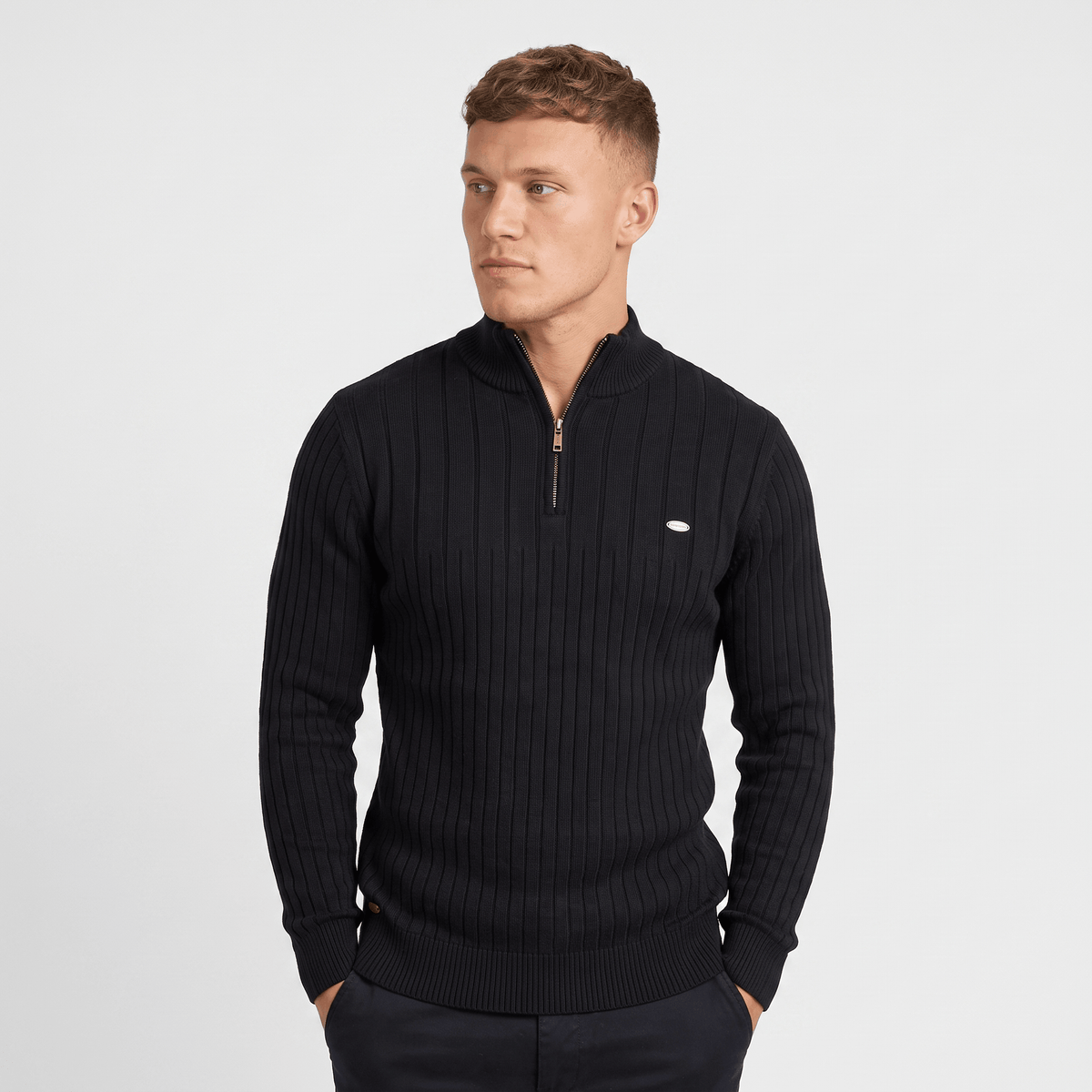 Back view of a men's black ribbed quarter-zip knit sweater with a stand collar and fitted silhouette.