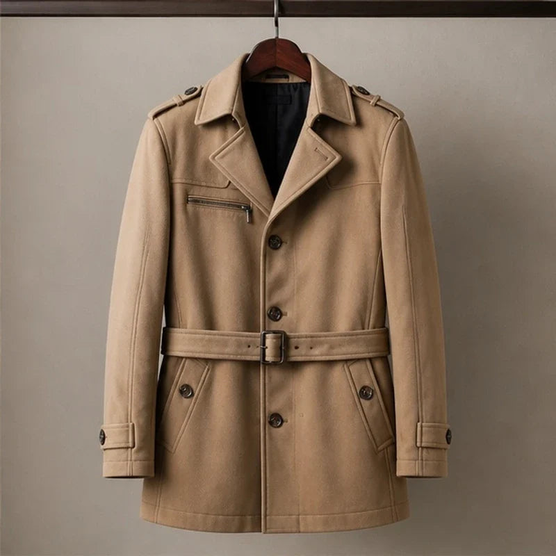 A camel cotton blend trench coat with a belted waist and structured collar, shown flat