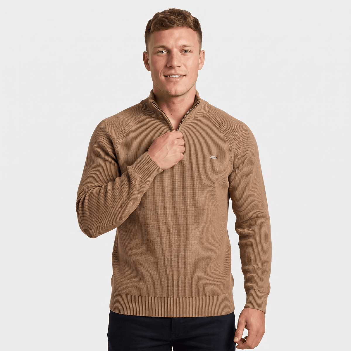 Man wearing a camel ribbed quarter-zip knit sweater with a stand collar, long sleeves, and a classic fit.