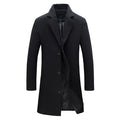 A black double-breasted winter trench coat with a tailored longline fit and full lining, shown flat