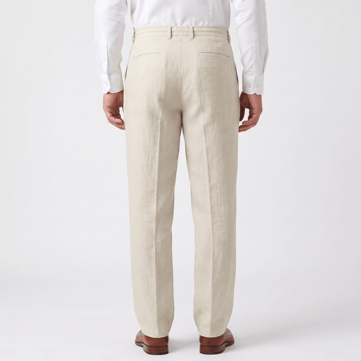 Back view of men's cream linen drawstring pants with an elastic waistband, straight-leg fit, and breathable linen fabric.