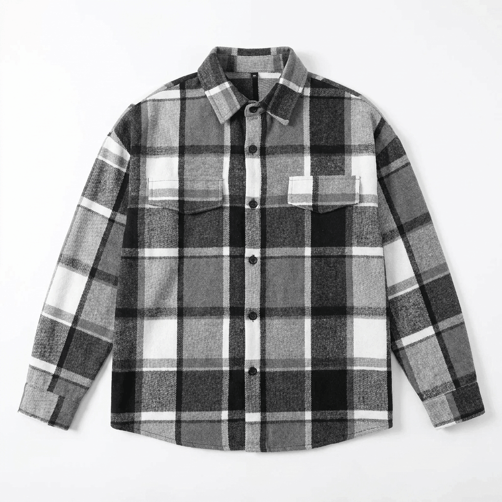 Black and white plaid overshirt jacket displayed flat, featuring a pointed collar, button-front closure, chest pockets, and long sleeves.