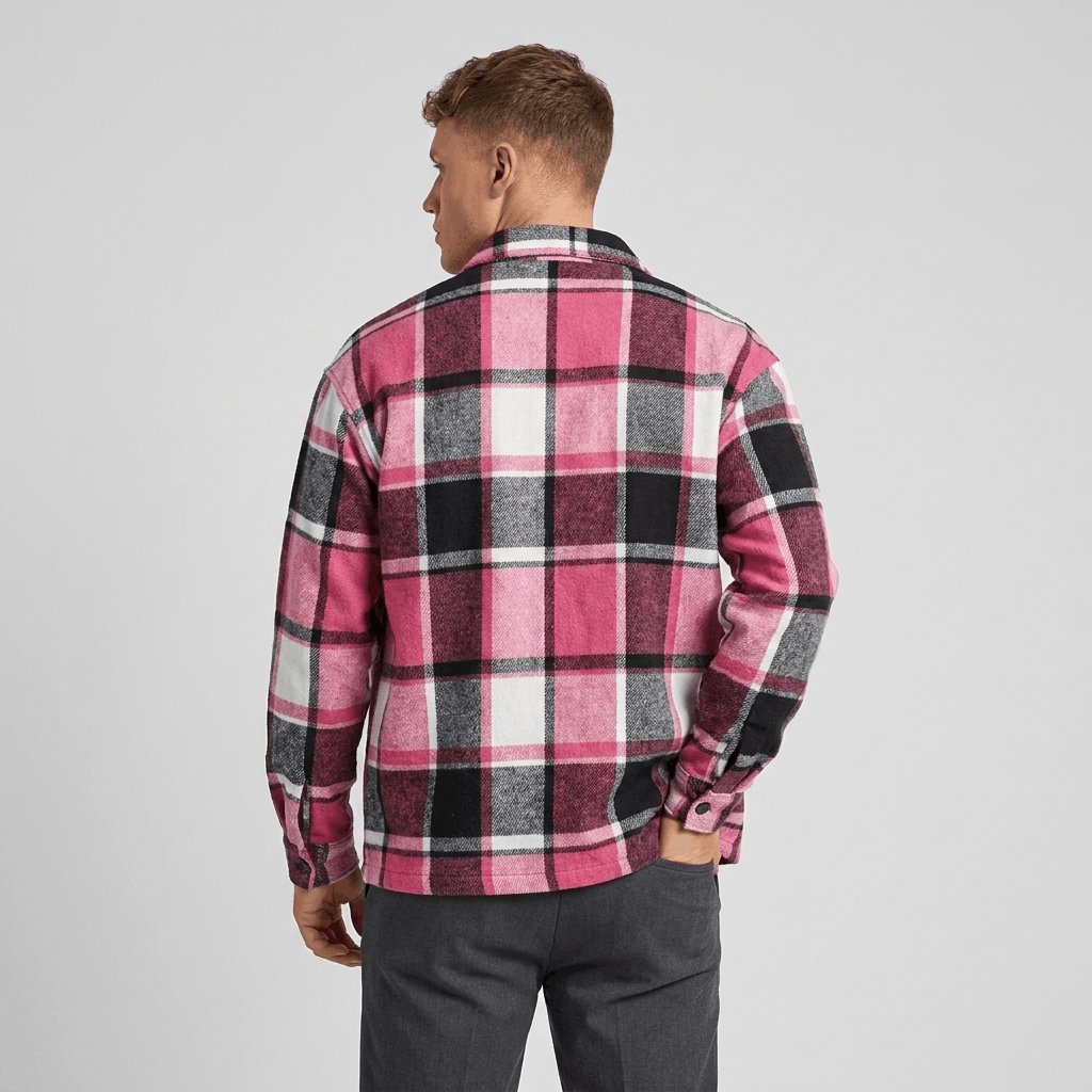 Back view of a man wearing a pink, burgundy, and white plaid overshirt jacket with a relaxed fit and long sleeves.