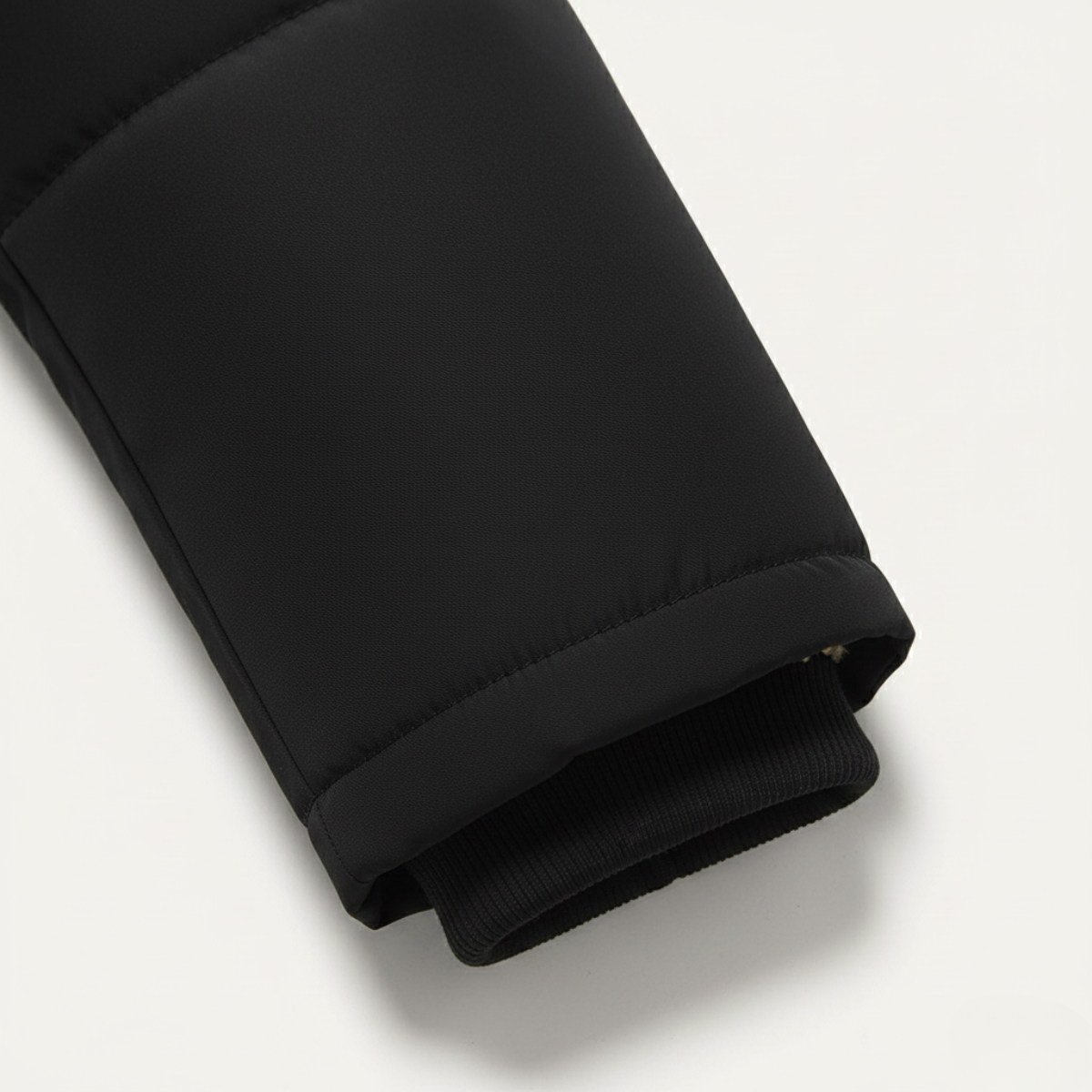 Close-up of the black parka sleeve cuff with fleece lining