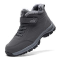 Black fleece-lined winter hiker boot with a hook-and-loop strap and rugged anti-slip sole, side view