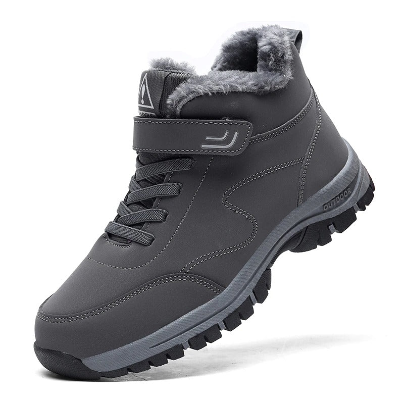 Black fleece-lined winter hiker boot with a hook-and-loop strap and rugged anti-slip sole, side view