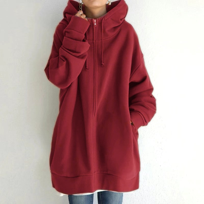 Red longline oversized drop shoulder fleece zip-up hoodie worn by a model, front view