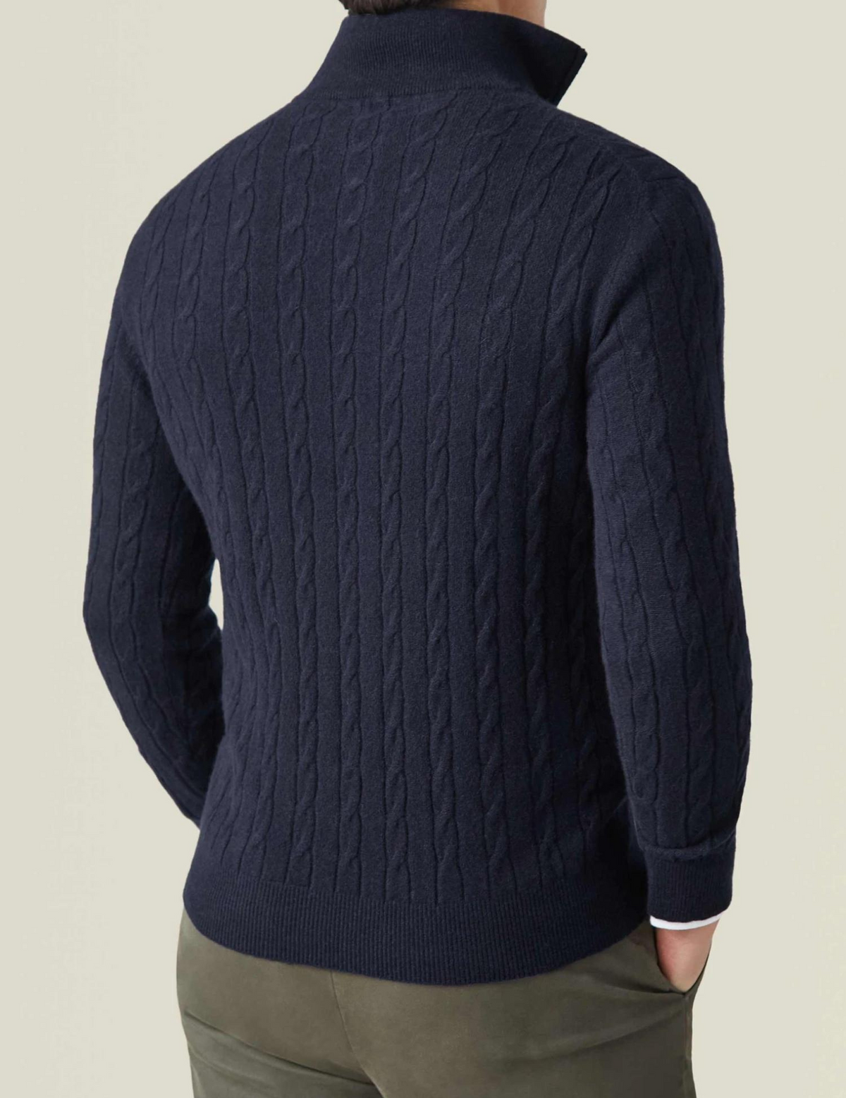Dark Blue cable knit V-neck sweater shown from the back, highlighting the textured knit pattern and ribbed hem