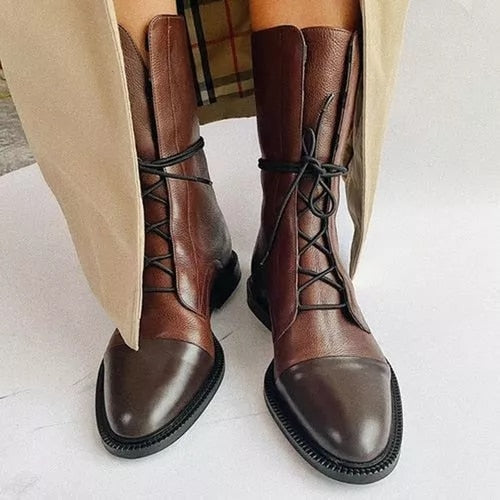 Brown leather lace-up ankle boots with low heels and rounded toes.