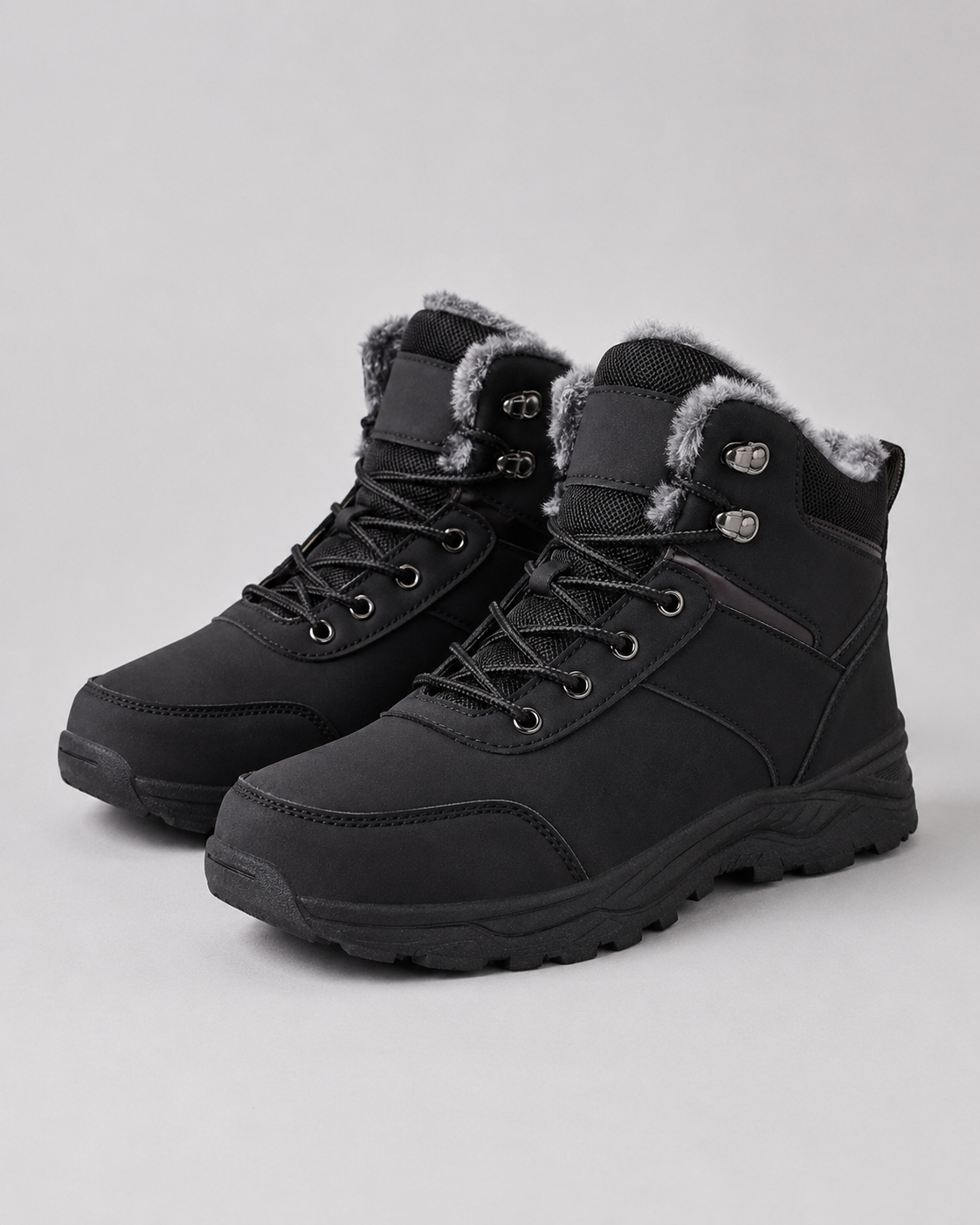 Black lace-up winter ankle boots with plush-lined collars and lug soles