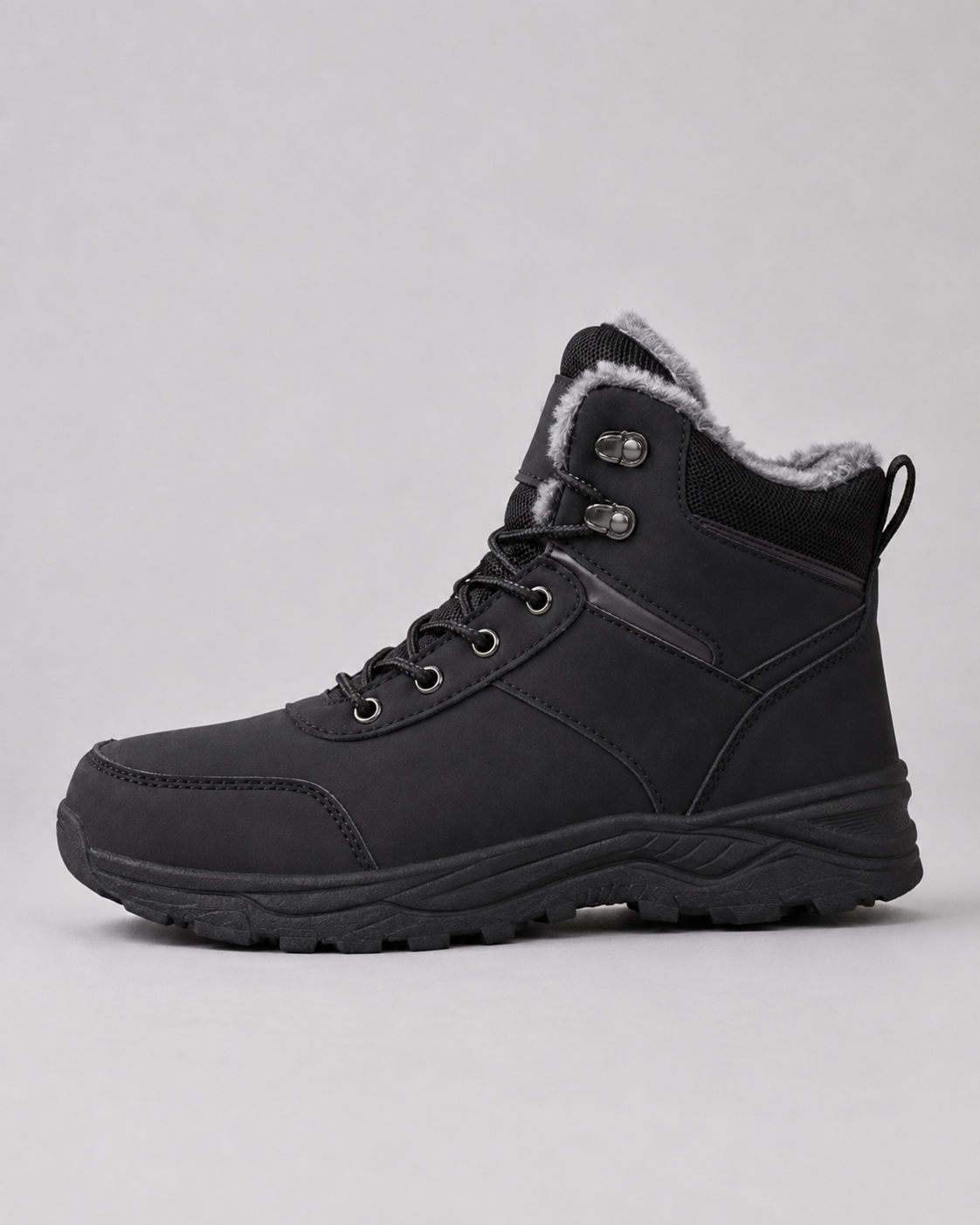 Black lace-up winter ankle boot with a plush-lined collar and lug sole, side profile