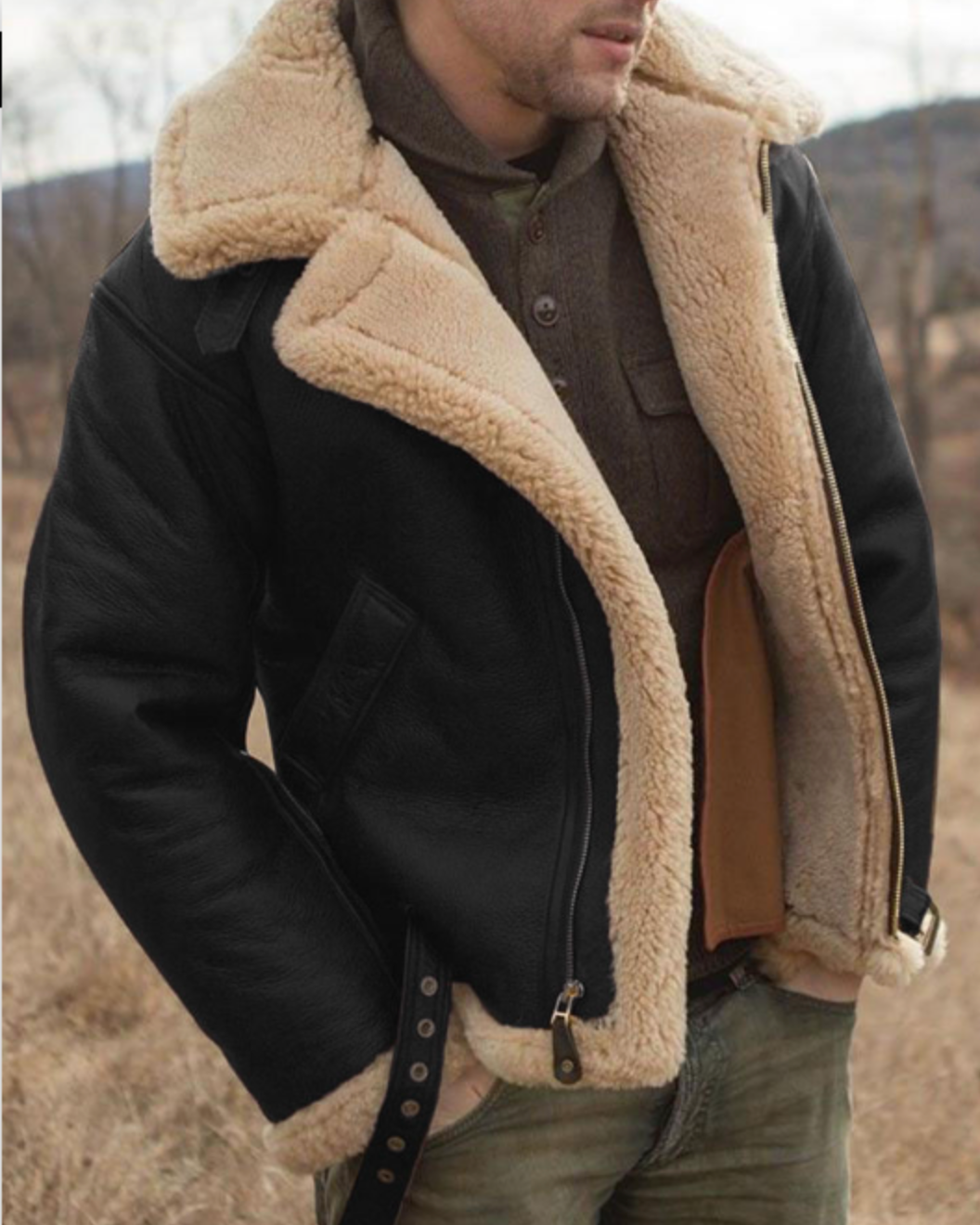 Black leather aviator jacket for men with sherpa lining, full-zip closure, wide collar, and regular fit, worn by a male model
