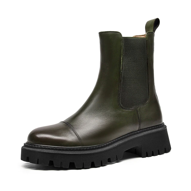 Side profile of a green leather Chelsea ankle boot for women with cap-toe seam, square heel and lug sole