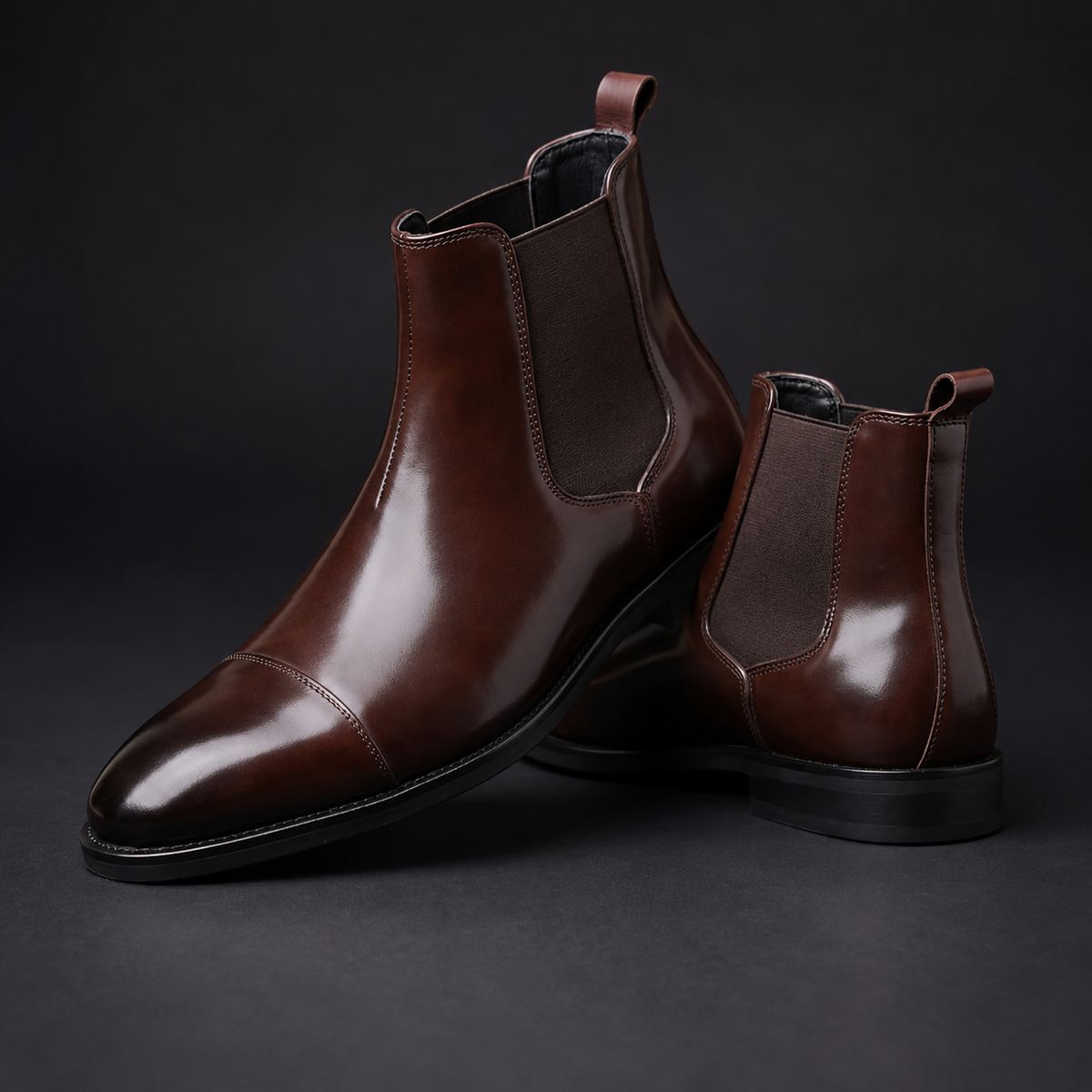 Brown polished leather cap-toe Chelsea boots for men with contrast sole edge and elastic side panels
