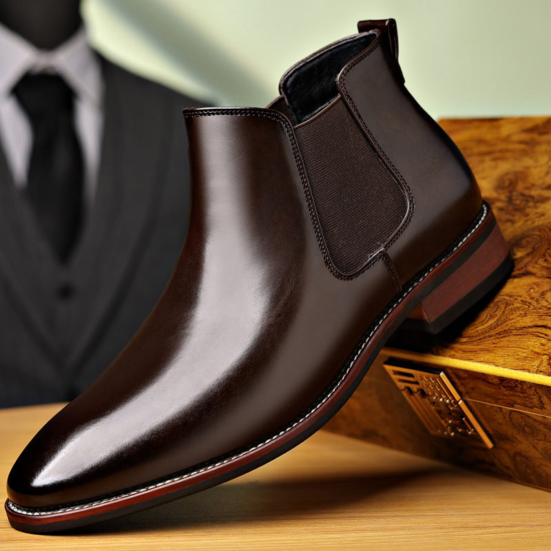 Pair of dark brown leather Chelsea boots displayed together, showing the elastic side panels and polished finish.