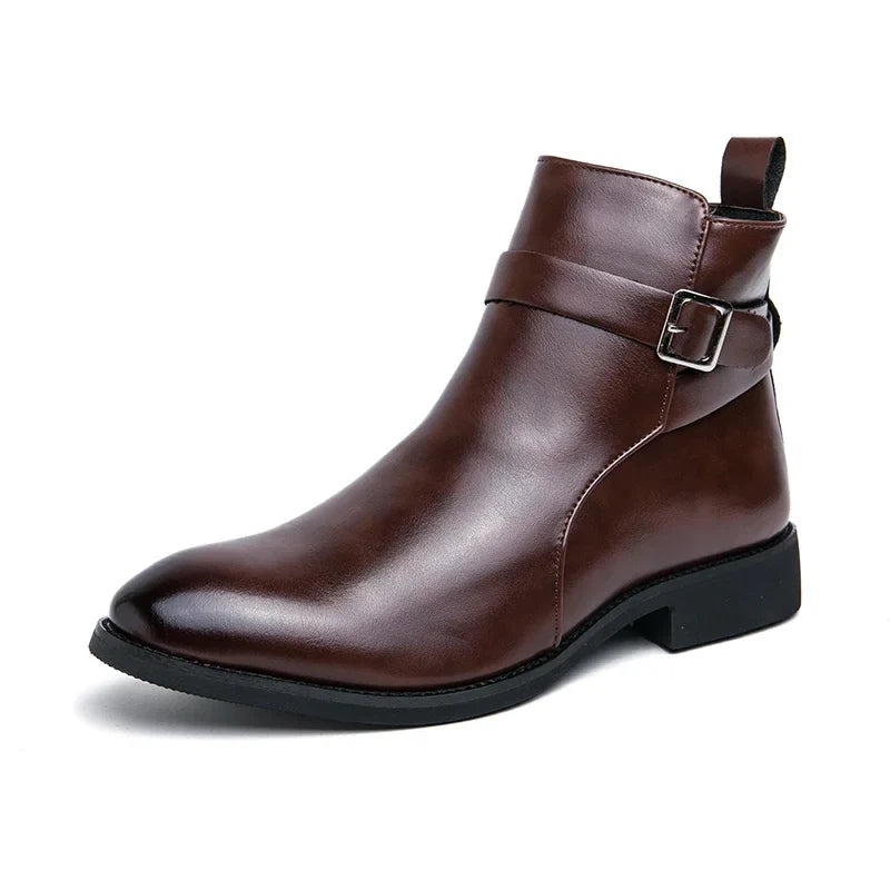 Close-up of dark brown ankle boots worn with dark trousers, highlighting the pointed toes and block heels.