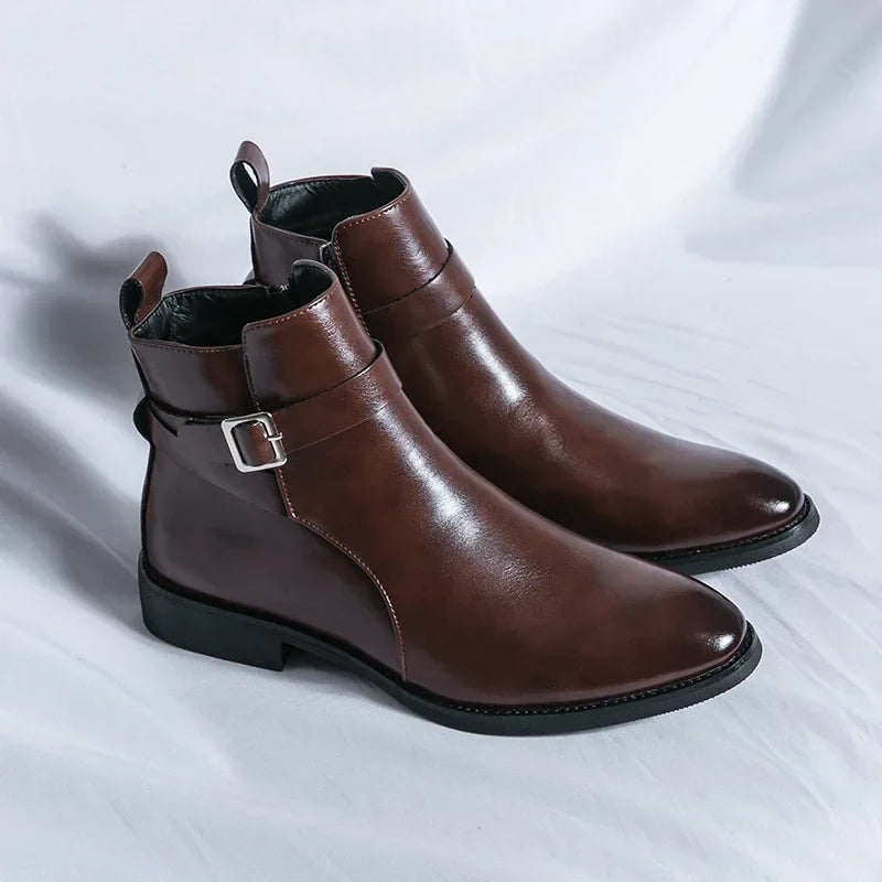 Pair of dark brown leather ankle boots with side buckles, pointed toes, pull tabs, and block heels.