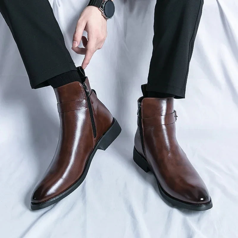 Person wearing dark brown leather ankle boots, showing the pointed toes, side buckles, and block heels.