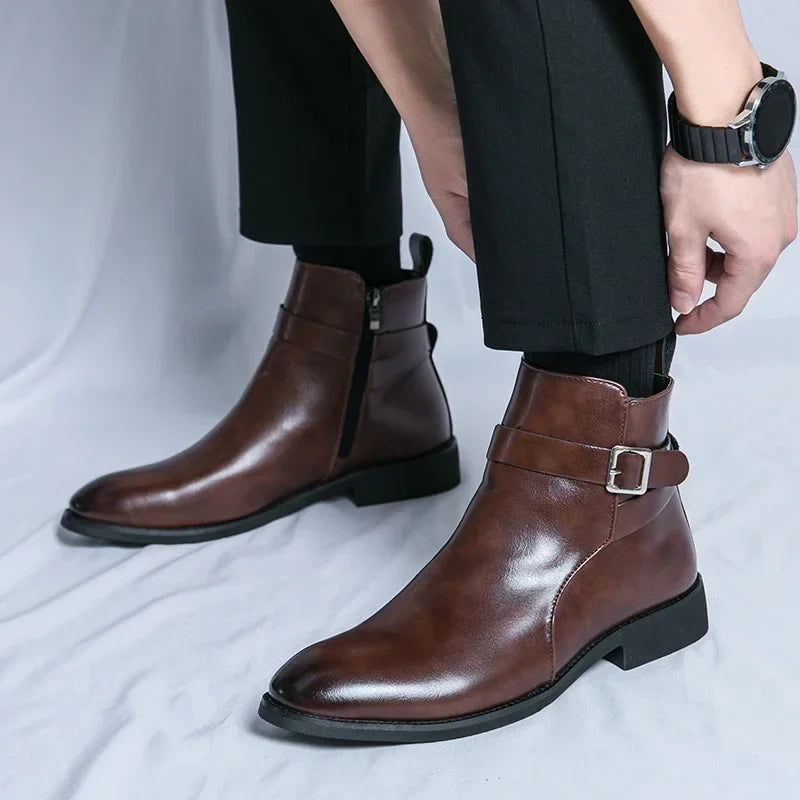 Person wearing dark brown ankle boots while seated, highlighting the pointed toe and block heel.