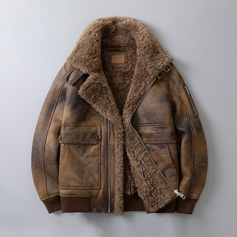 A brown leather shearling jacket with plush lining, a wide shearling collar, zip front, and ribbed cuffs, shown flat