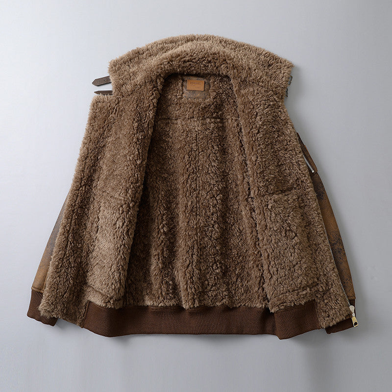 A brown leather shearling jacket with plush lining, a wide shearling collar, zip front, and ribbed cuffs, shown from the back