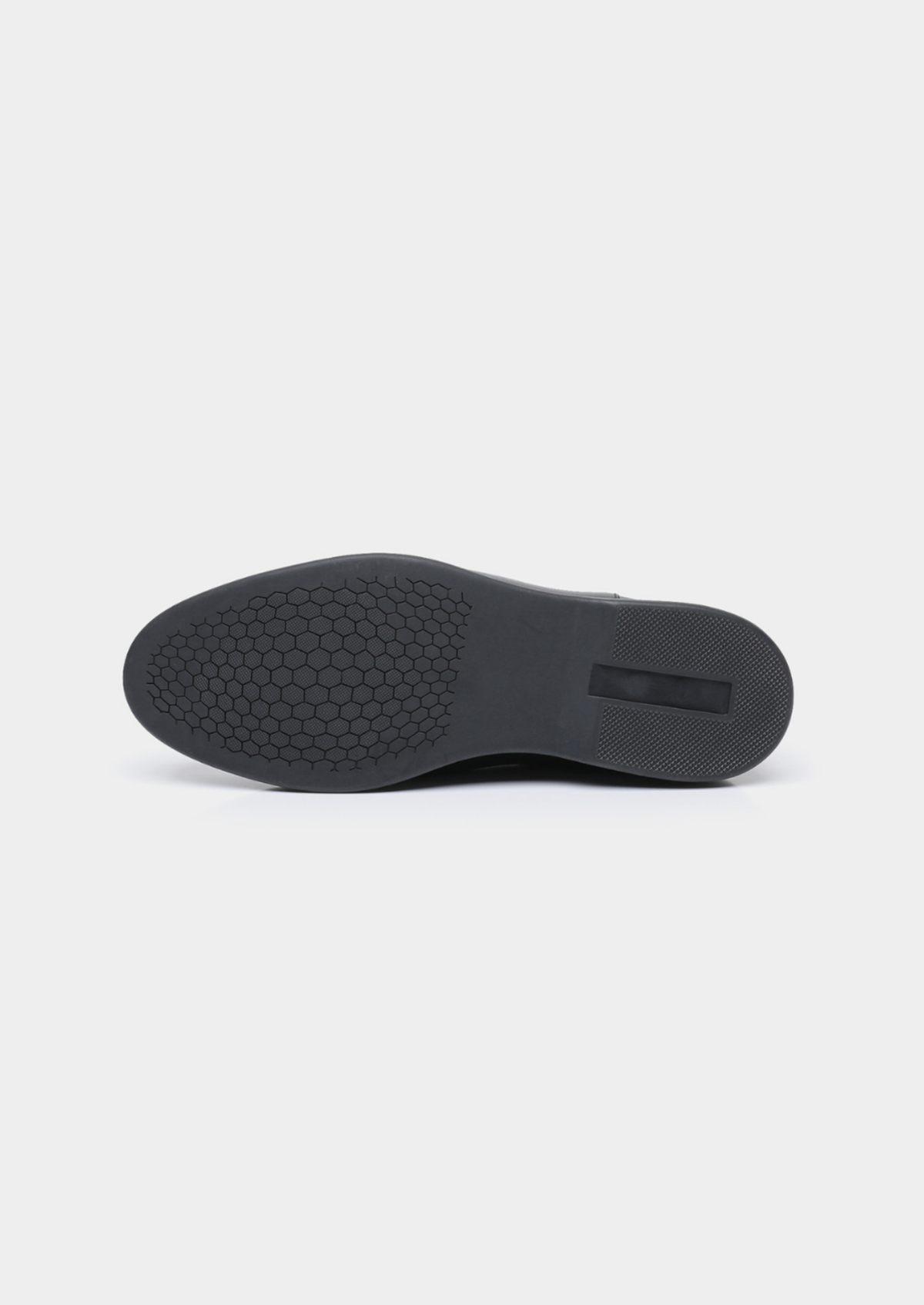 Black boot outsole showing the textured tread pattern.