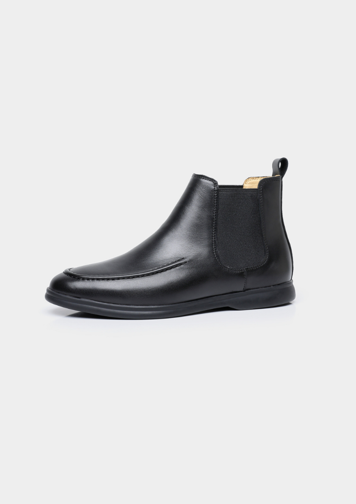 Single black Chelsea boot showing the elastic side panel and low-profile sole.