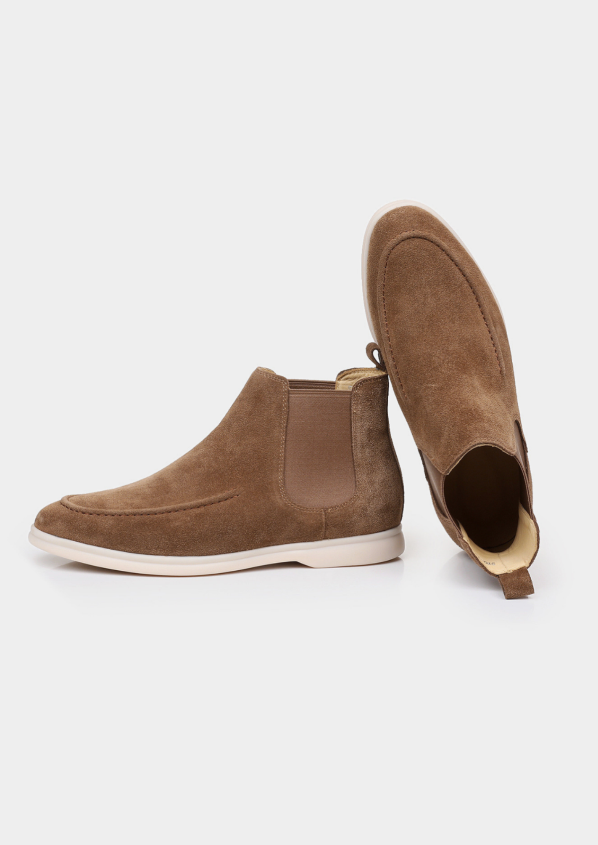Brown suede Chelsea boots displayed from different angles, showing the elastic side panels and pull tabs.