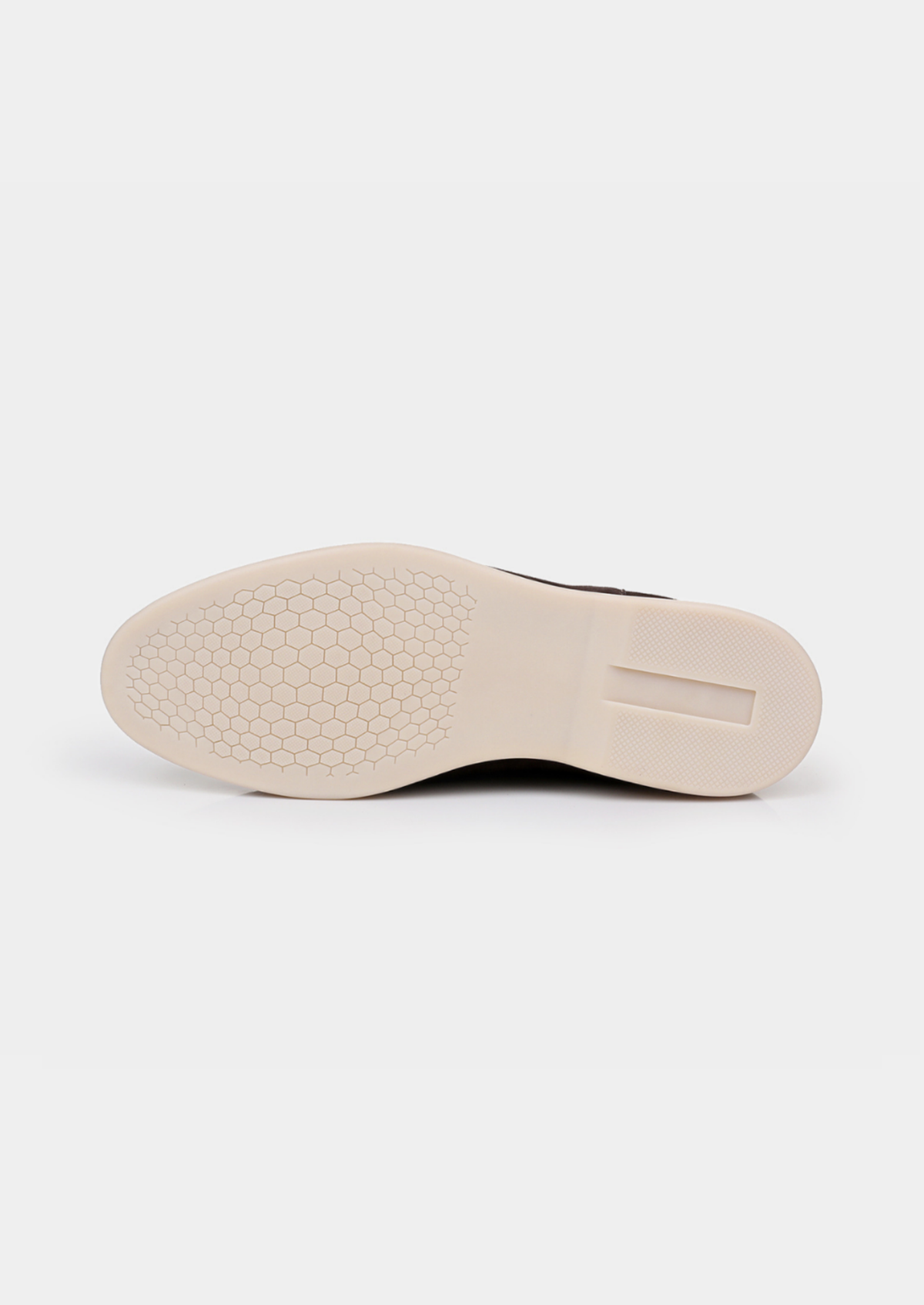 Brown suede boot outsole showing the textured tread pattern.