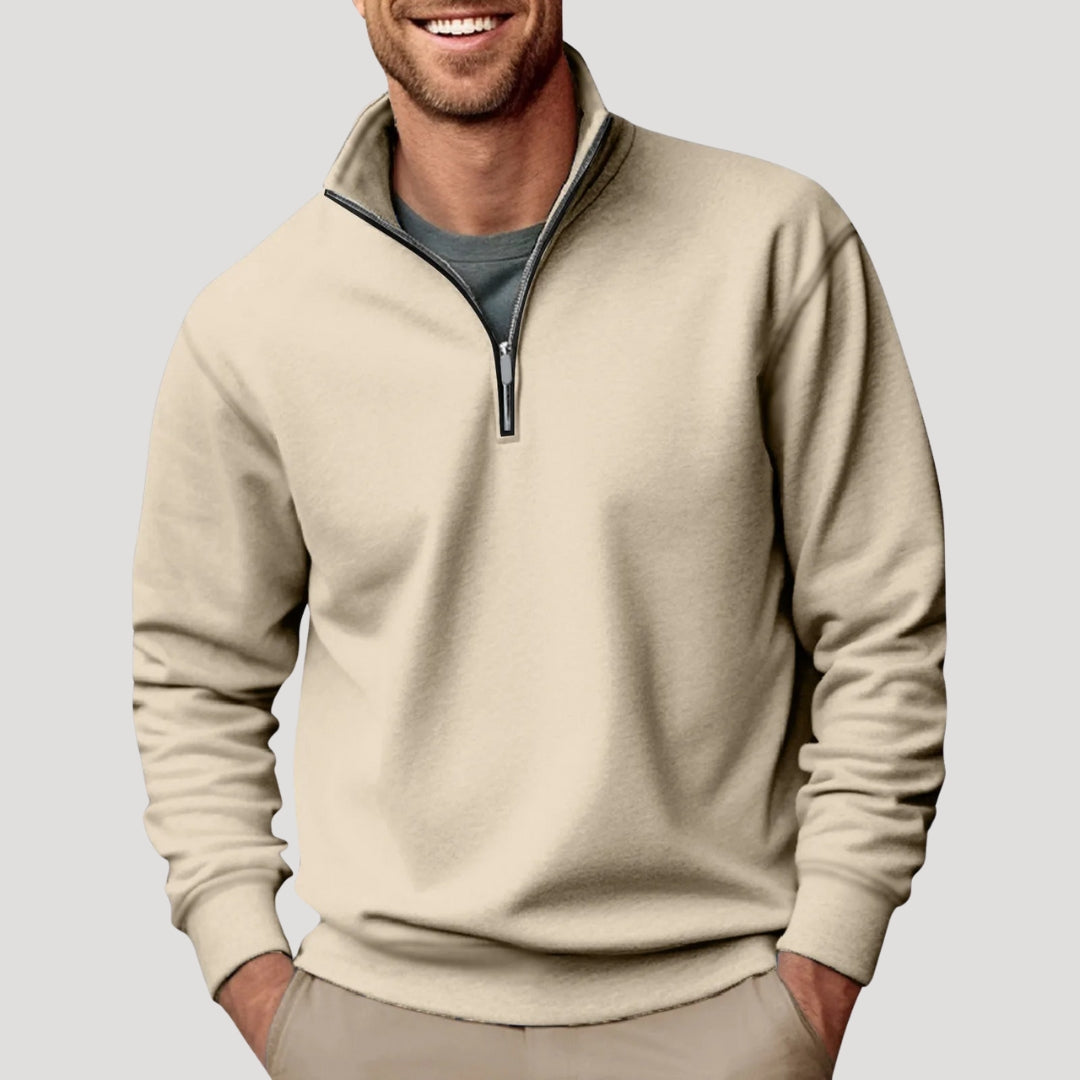 Beige quarter-zip pullover sweatshirt worn by a male model with long sleeves and ribbed hem