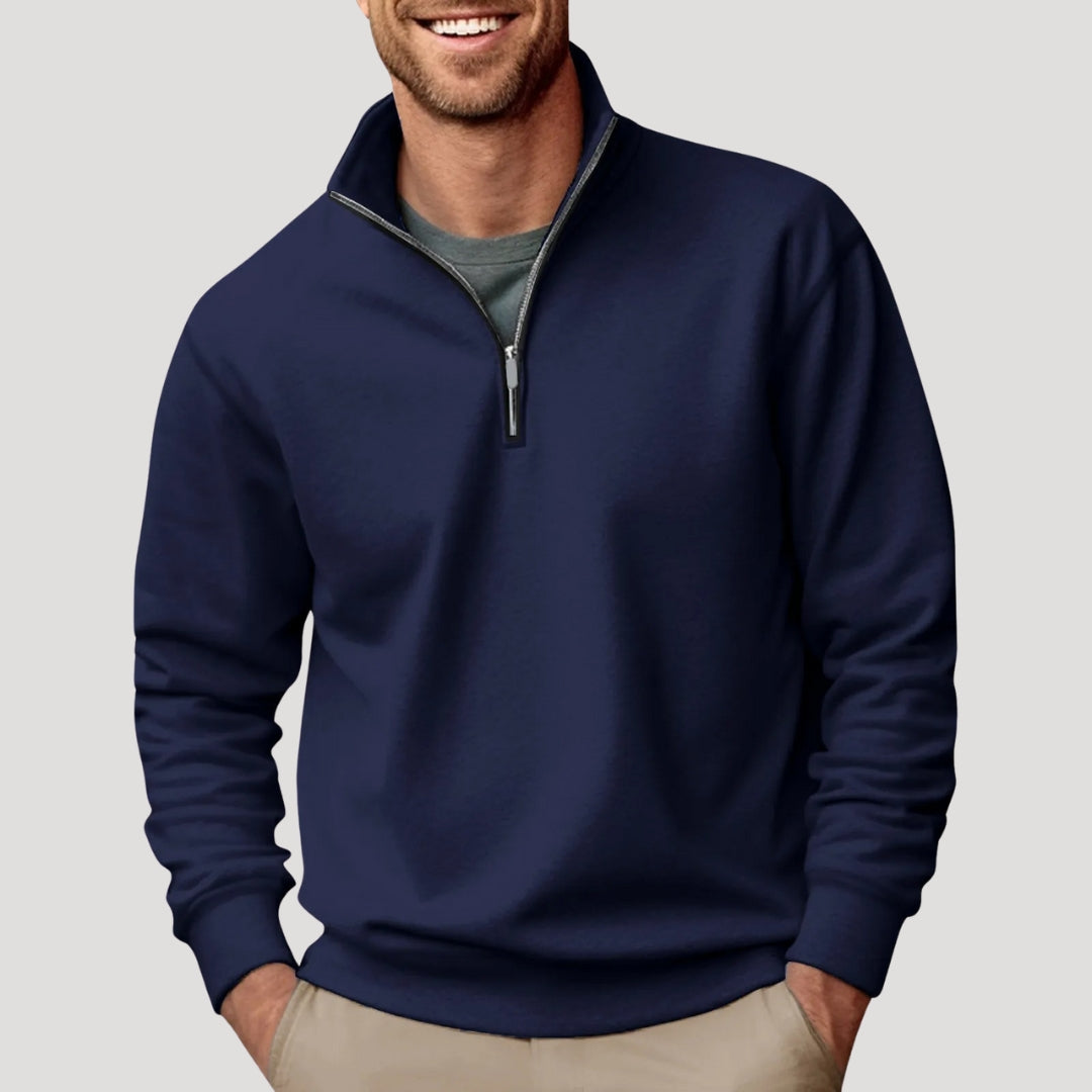 Navy Blue quarter-zip pullover sweatshirt worn by a male model with long sleeves and ribbed hem