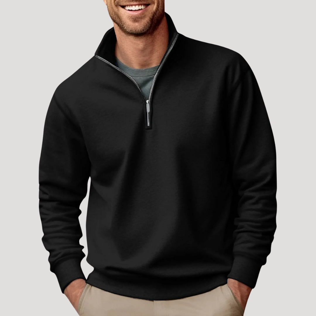 Black quarter-zip pullover sweatshirt worn by a male model with long sleeves and ribbed hem