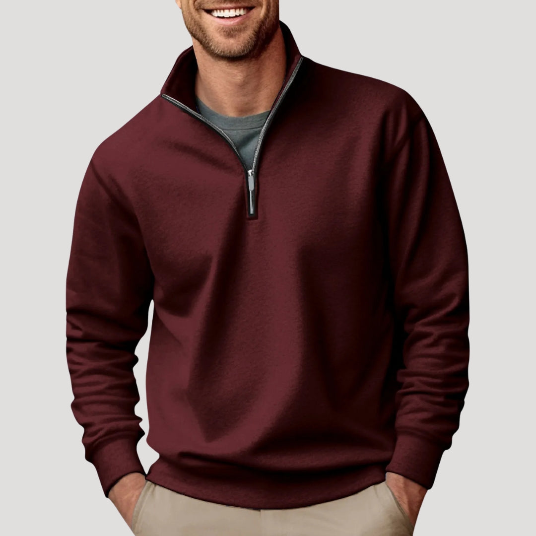 Burgundy quarter-zip pullover sweatshirt worn by a male model with long sleeves and ribbed hem