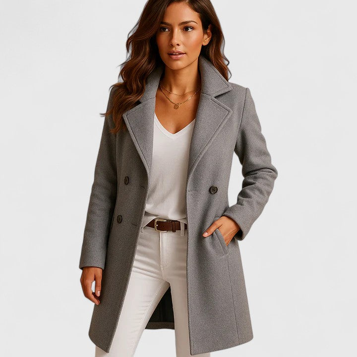 A woman wearing a gray long wool coat with a slim fit and notch collar