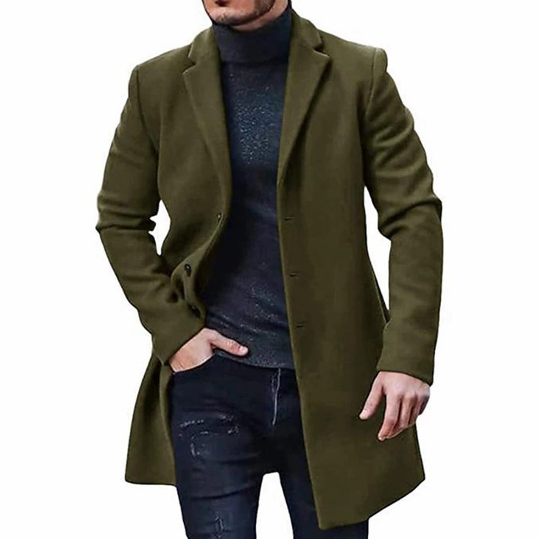 A man wearing an olive green mid-length wool coat with a single-breasted front and tailored fit, front view