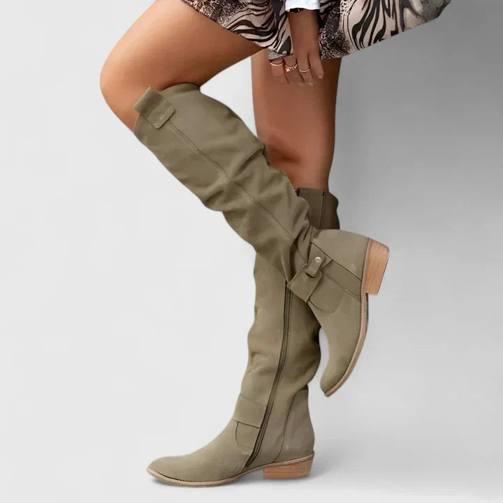 Olive green suede over-the-knee boots with a slouchy shaft, almond toe, side zip, and low block heel.