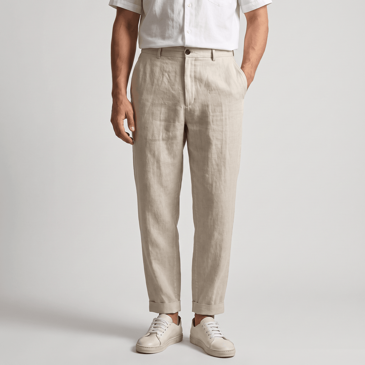 Men's light beige linen pants with a straight-leg fit, belt loops, and classic tailored design.
