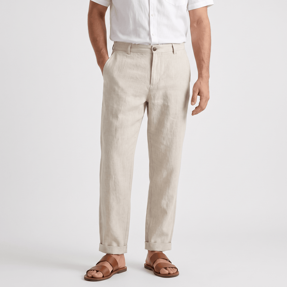 Men's beige linen pants with a straight-leg fit, button closure, belt loops, and side pockets.