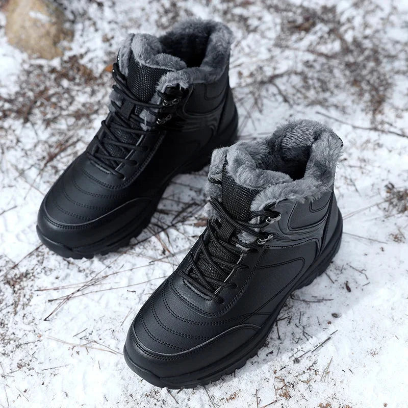 Pair of black plush-lined winter boots with water-repellent uppers and rugged non-slip soles, resting on snow
