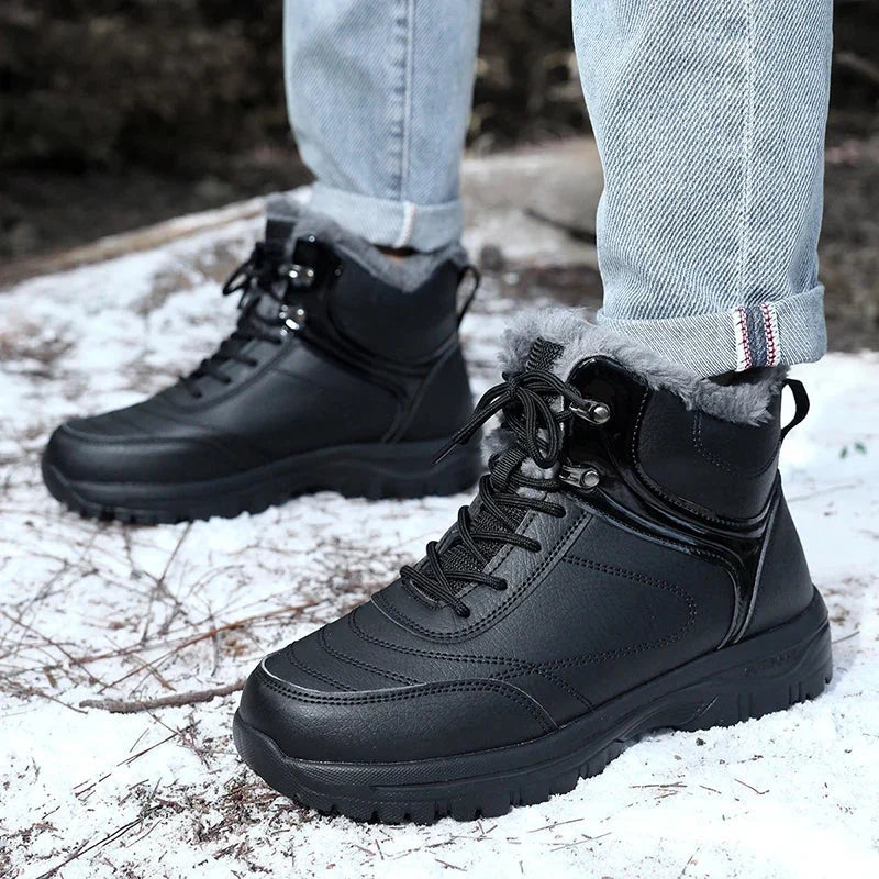 A person wearing black plush-lined winter boots with water-repellent uppers and non-slip soles