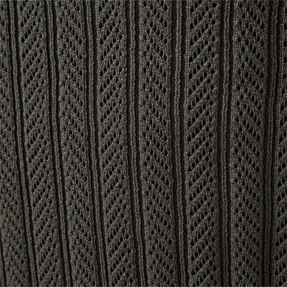Dark Olive cable knit sweater close-up showing the vertical textured knit pattern