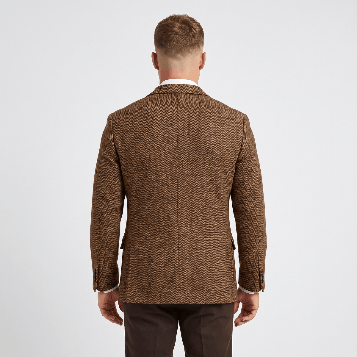 Back view of a men's brown tweed blazer featuring a tailored fit, textured fabric, and classic blazer construction.