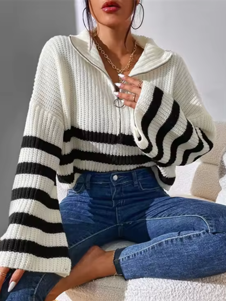 White and Black striped relaxed fit half-zip sweater with a high collar, long sleeves, and bold horizontal stripes
