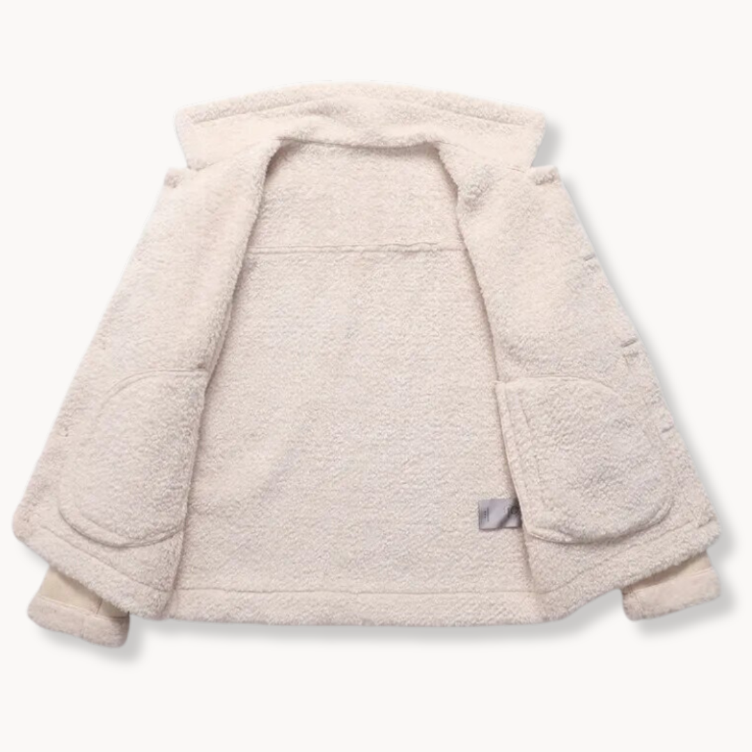 A white shearling leather jacket with plush lining and buckle collar, shown from the back