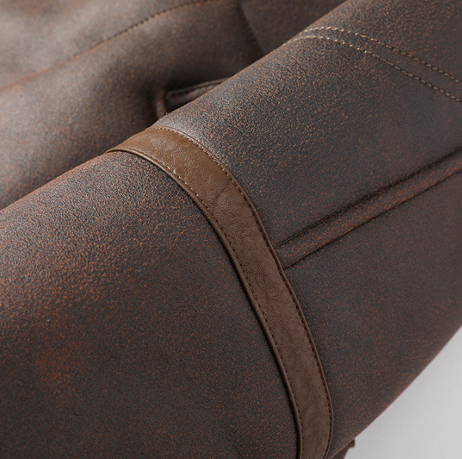Dark brown aviator jacket close-up showing the leather sleeve seam and thick sherpa-lined cuff
