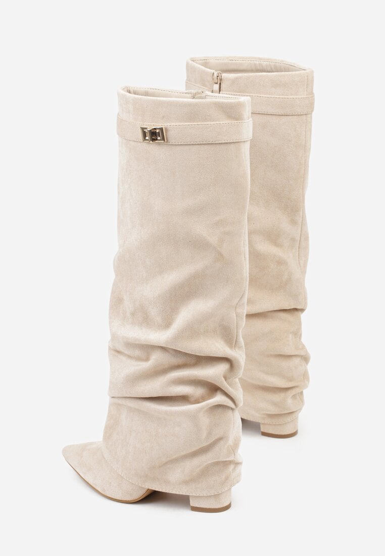 Cream suede slouchy knee-high boots shown from the back.