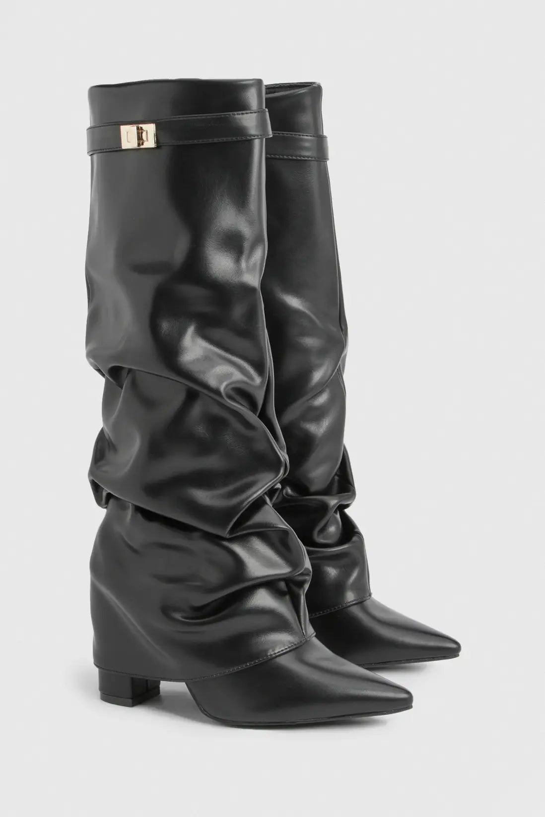 Pair of black leather slouchy knee-high boots with ruched shafts and pointed toes.