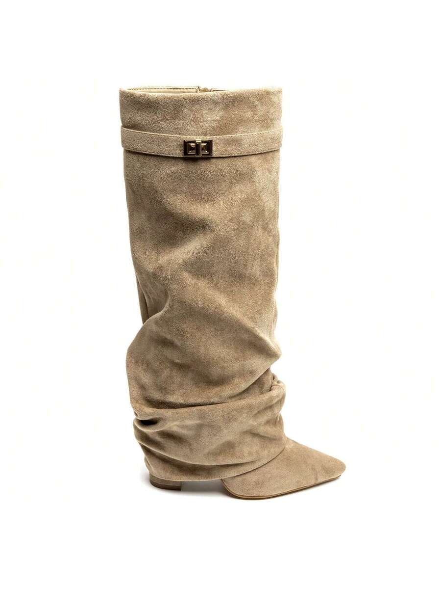 Beige suede slouchy knee-high boots with a low block heel and small buckle detail.